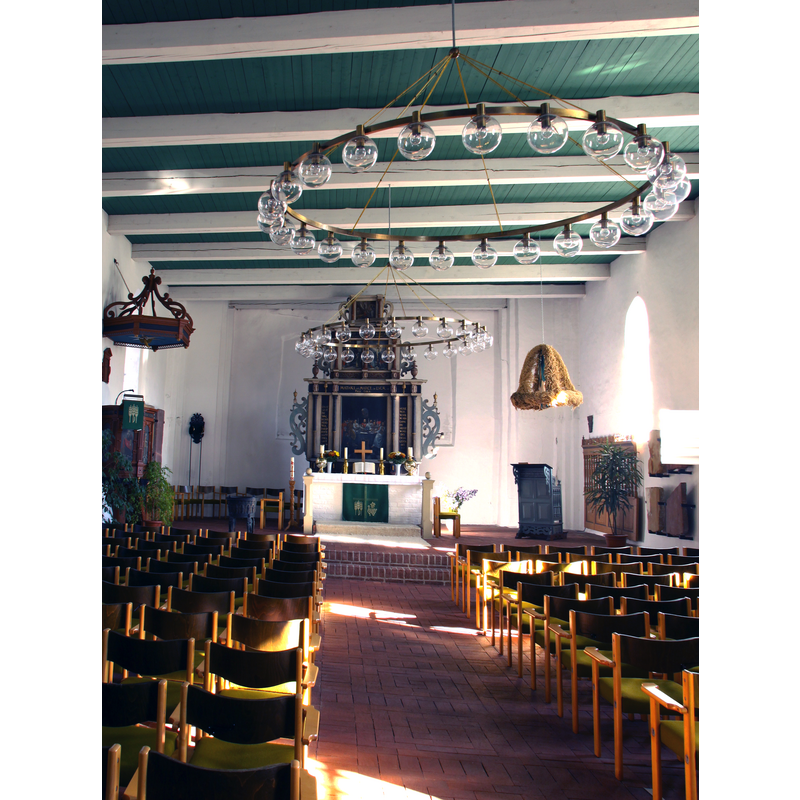 the old bronze font is partially visible at the far [east] end], left [north] side of the nave