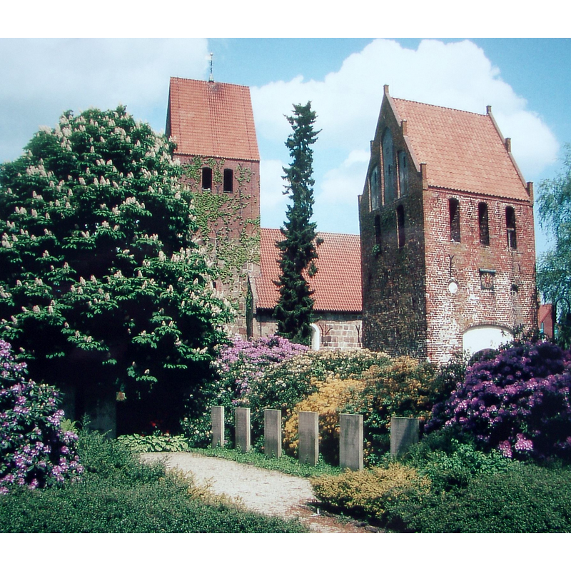 the church has two bell towers, one detached from the main body
