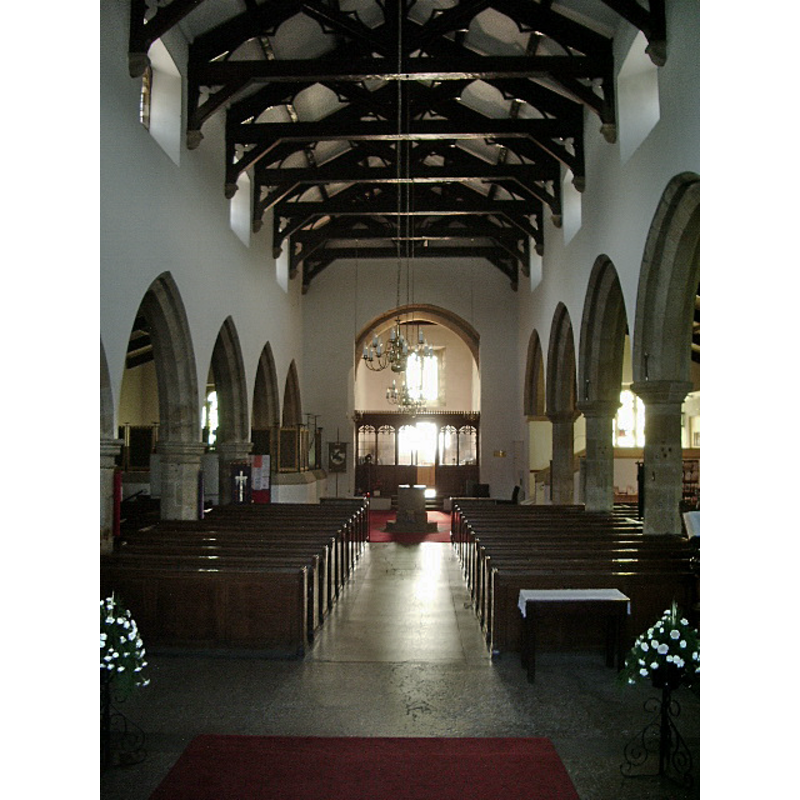 the baptismal font is visible at the far [west] end of the centre aisle