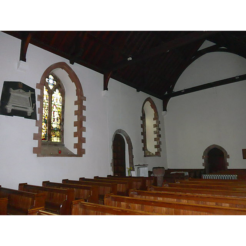 the baptismal font is visible at the southwest corner of the nave, just west of the south entranceway