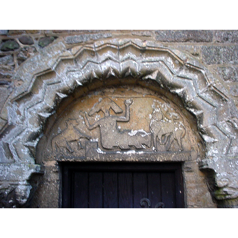As the CRSBI suggests, although it is now the priest's doorway, it must have been originally the main portal