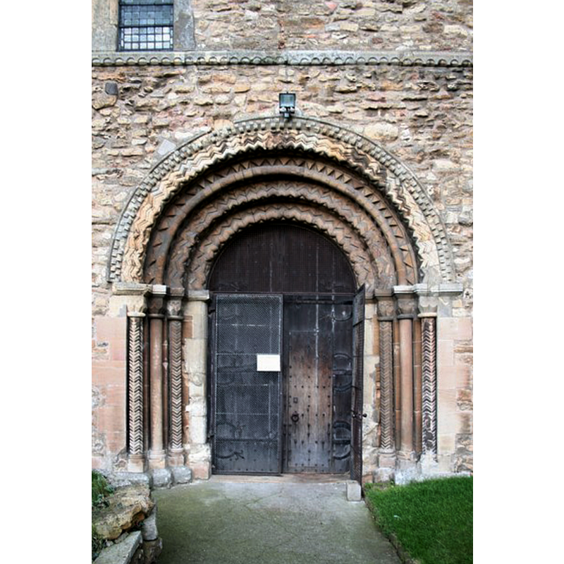 Source caption: "Norman south door. South doorway to the splendid church of St.Mary at Stow, c1140 with three orders of colonnettes and arches with zig zag decoration."