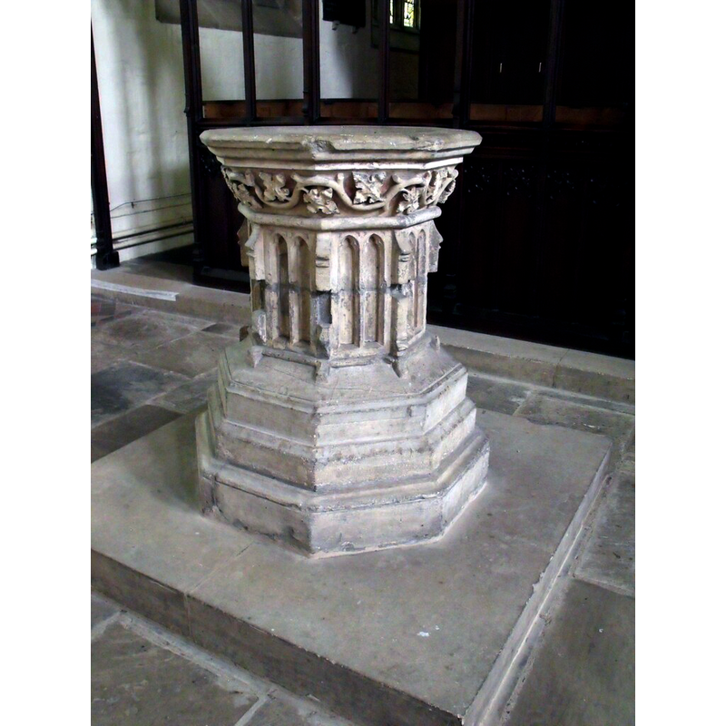 the 15thC font is now located in the north aisle.
