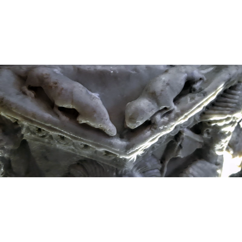 the spandrels of the arcade are populated with a variety of animals; this one has two quadrupeds opposed