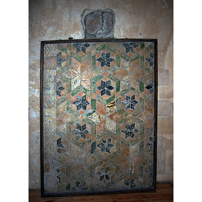 Source caption: "Revesby Abbey remains. Medieval floor tiles re-set in the ringing chamber of St.Lawrence's tower [...] from the site of Revesby Abbey, founded 1142, dissolved 1539."