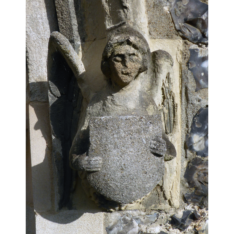Source caption: "A carved angel on the western doorway of St Nicholas' Church in Chislehurst, southeast London."