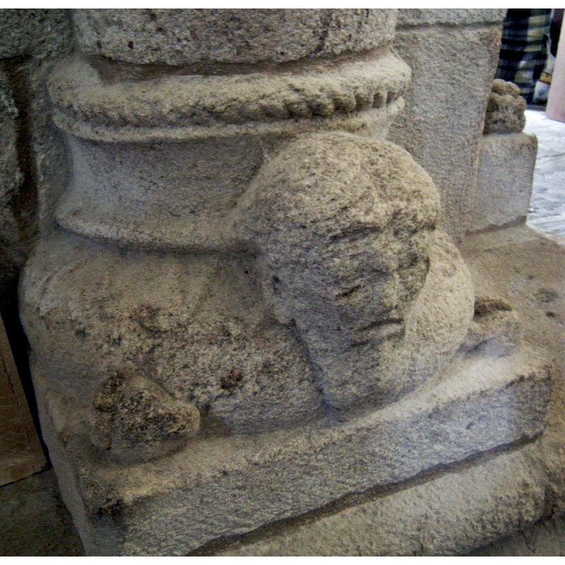 grotesque head with two pairs of eyes
