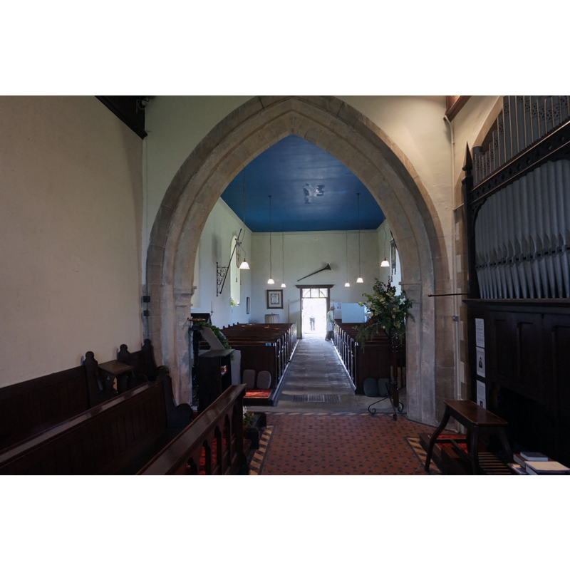 view from the chancel; partly visible at the far [west] end, left [south] side, is the modern font