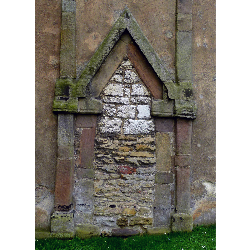 Source caption: "St Peter's Church, Barton-upon-Humber, Lincolnshire, England. Showing bricked-up doorway in north wall of tower."