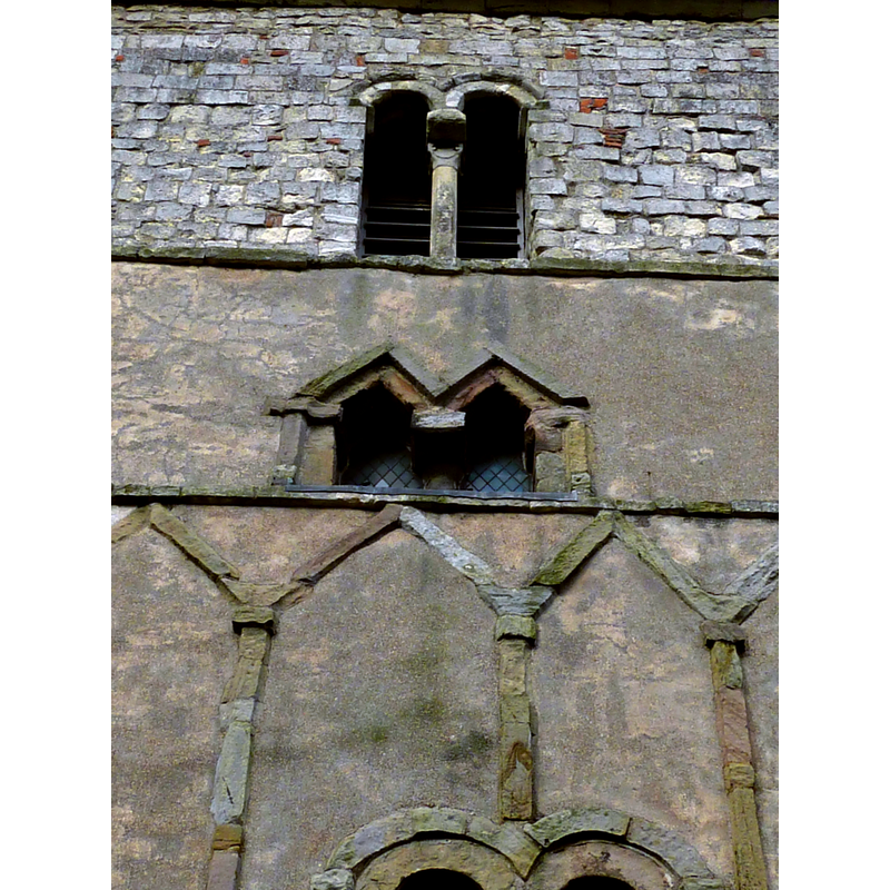 Source caption: "St Peter's Church, Barton-upon-Humber, Lincolnshire, England. Showing windows in south wall of tower. The top section is the Norman belfry. The section below is Saxon (well, the walls, anyway)."
