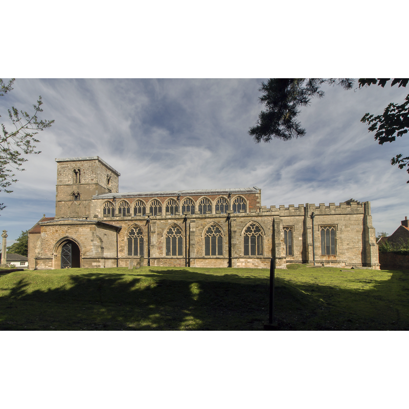 Source caption: "The church actually consists of two churches joined lengthways, the western church dates back to the ninth century with a 10th century tower, and is one of the earliest remains of Saxon architecture. The chancel was demolished to make way for the later church. The Saxon church consisted of three parts, the central part being the tower which served as a nave. To the west was a baptistery, and to the east there was a chancel. The church was enlarged around the time of the Conquest and a bell stage was added to the tower. The Saxo-Norman nave, chancel, and apsoidal sanctuary were added in the late 11th century. Soon after, aisles were added and later enlarged. The chancel was rebuilt in the 15th century, and the clerestory was added to the nave. The south arcade dates from the 14th century and is of five bays, although this was reduced to four with the building of the chancel, the original sanctuary being replaced. The north arcade is decorated with some reused 13th century material. There are several 14th century grotesques and human heads which form label stops to the arcades.[...] There were major restorations in the mid 18th century and in 1858, with further restoration by Fowler in 1897 [...] The church was closed in 1970 and is now in the care of English Heritage. Extensive excavation was conducted between 1978 and 1984. The churchyard is reputed to have over 2800 burials."