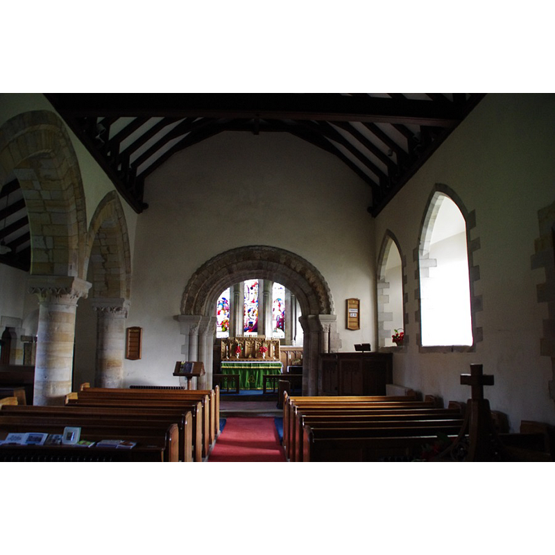 the cross finiial of the modern font cover seen here in the foreground, right side