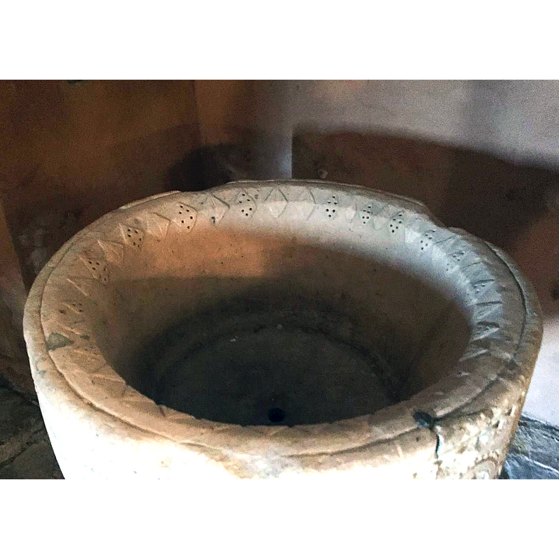 a row of on the internal side of the rim; every other motif is perforated with six holes arranged three-up-three-down