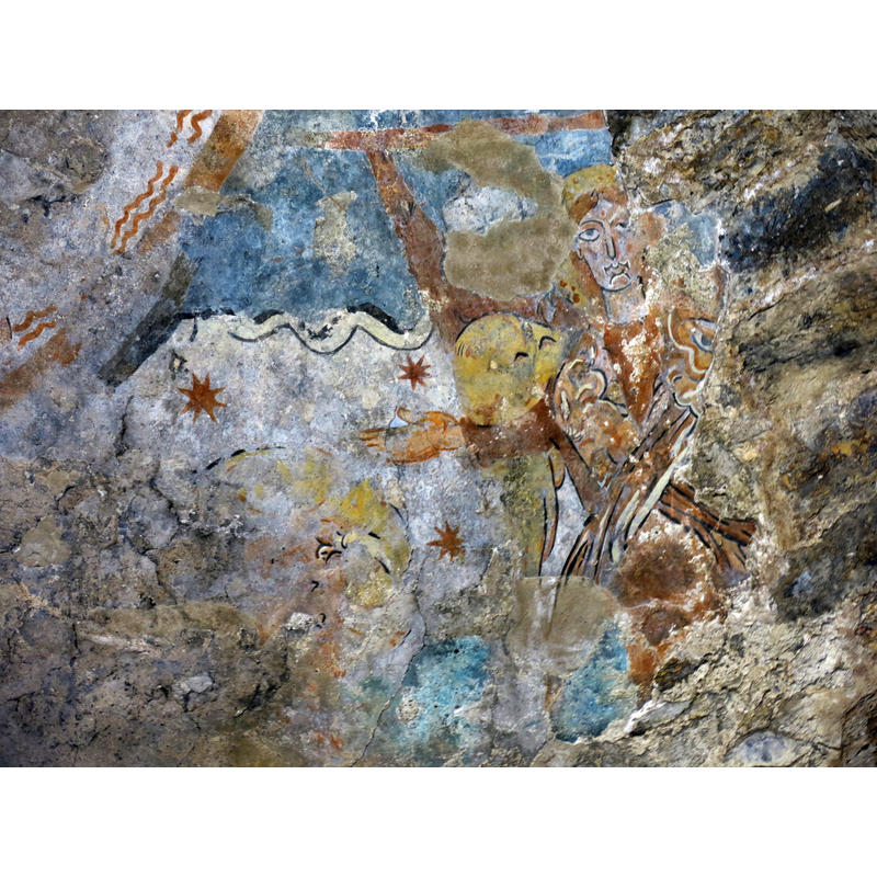 interior view of the monastic church of Sant Quirze: remains of mural paintings in the south apse; an angel is discernible on the right