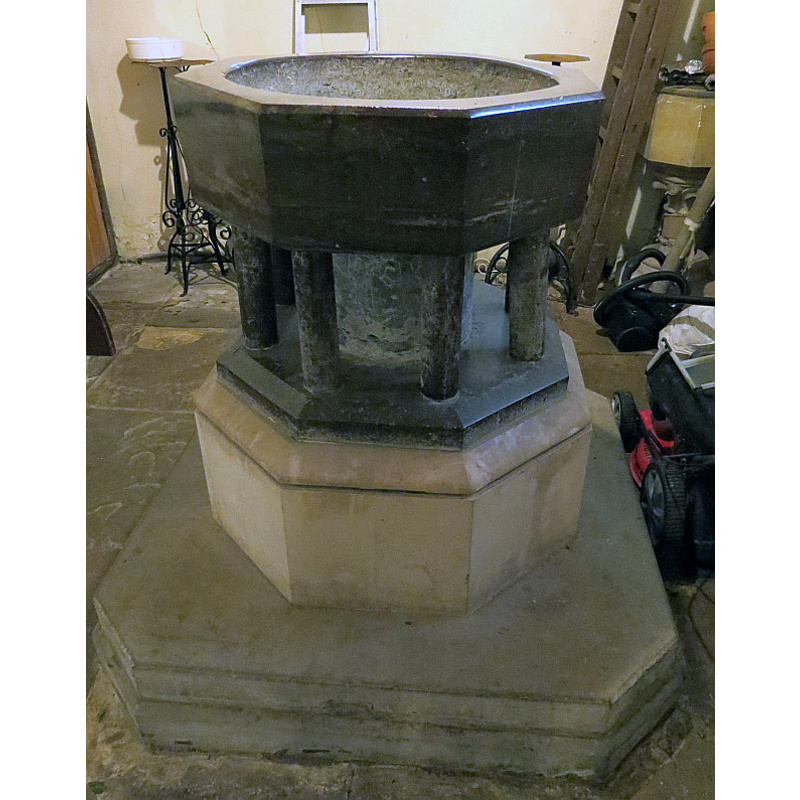 showing the altered the medieval font in the foreground, and the modern font in the background, right side, semi-hidden by a step-ladder