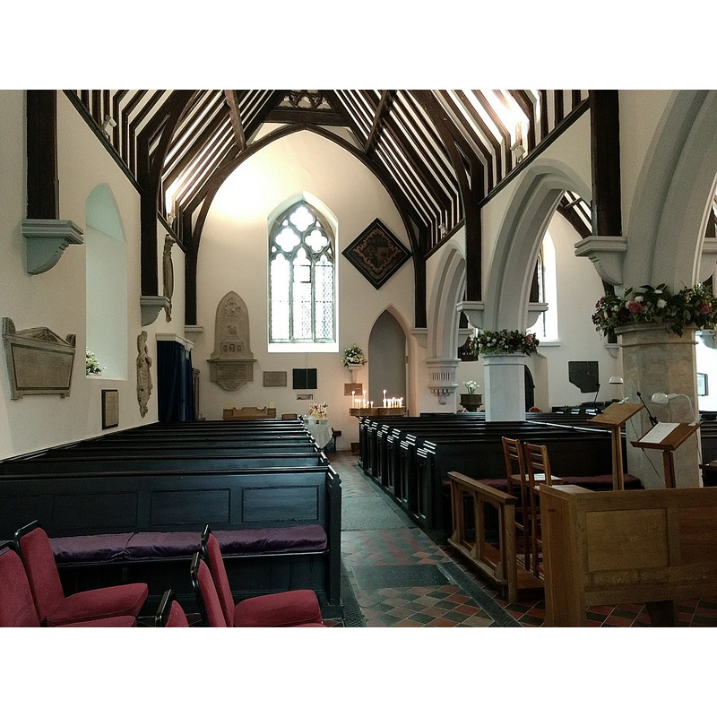 the modern font is partially visible at the far [west] end of the right [north] aisle