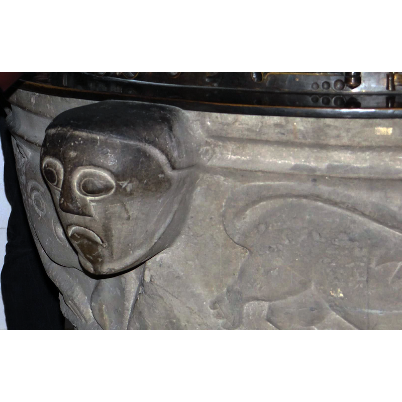 between the marine monster and the lion passant to the right