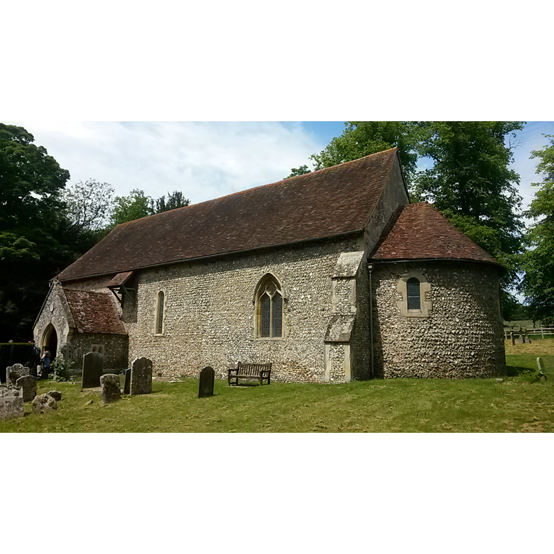 the church has no belfry or tower; the little roof-canopy by the east side of the porch covers the single bell of this church