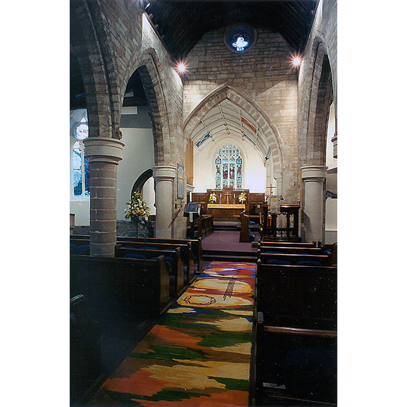 the font, moved to the east end of the north aisle in 1985, is partially visible in the leftmost part of the image