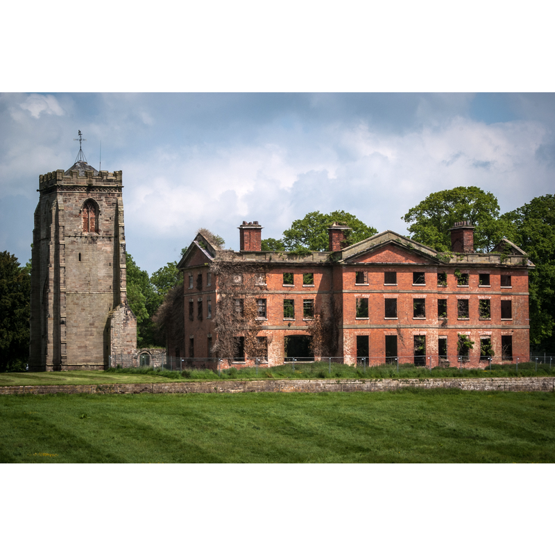 Source caption: "Ranton Abbey / Abbey House remains. Ranton Abbey "was founded by Robert and Celestia Noel of Ellenhall about 1150 for Augustinian canons from Haughmond. In 1820 Thomas, 1st Earl of Lichfield, built a large house, a hunting lodge or weekend retreat, adjacent to the abbey...all that remains of the abbey is the large imposing tower (of the 15th century) and a little of the nave wall with a Norman doorway decorated with roll moulding. The house...is now in ruins...it was accidentally burned down in 1942, during the Second World War, when troops of Queen Wilhelmina's bodyguard were quartered here."