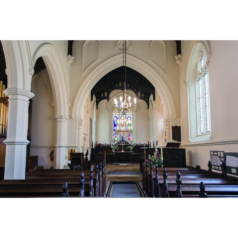 Source caption: "Hackthorn dates back to Roman times, and there was a church recorded in the Domesday book. Some remnants of the Saxon church were incorporated into the current building. In the 18th century the old church was in a poor condition, the roof was quoted as being "ruinous and out of repair", the steeple was described as dangerous, so a new roof was built and the steeple demolished. In 1805 the church was reduced in size, but in 1844 the accommodation needed enlarging once again, and a subscription list was set up to fund this. In October 1844 the foundation stone for a new aisle was laid, and work began.The church was barely finished in 1849 when the first service was held. The church consists of a western tower, nave, north aisle and porch, vestry, and chancel. The tower is built in the 14th century style with a battlemented parapet and crocketted pinnacles. There are gargoyles in the form of Griffins and Lions. The nave has a three bay arcade with octagonal piers. At the west end there is a finely carved gallery. All the fittings are 19th century. There are numerous label stops with human heads."