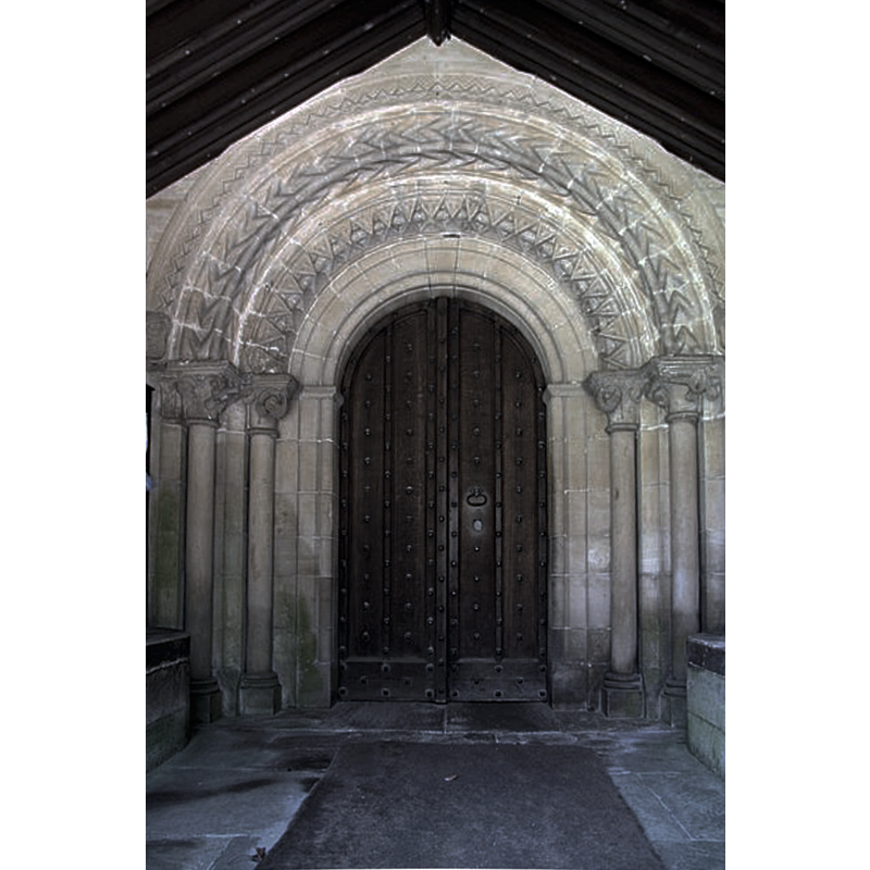 Source caption: "Much-restored 12th century north doorway to St.Michael & All Angels church".
