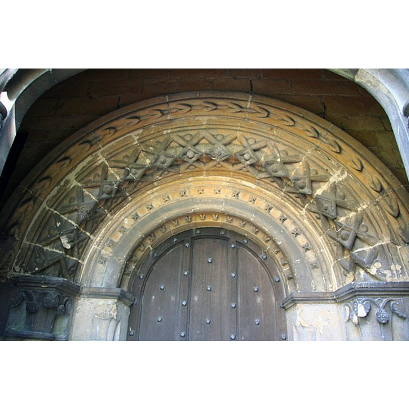 Source caption: "Norman Doorway. Genuine 12th century west doorway retained by the Amcotts family of Hackthorn Hall as their private entrance when St.Michael & All Angels church was almost entirely rebuilt in 1850."