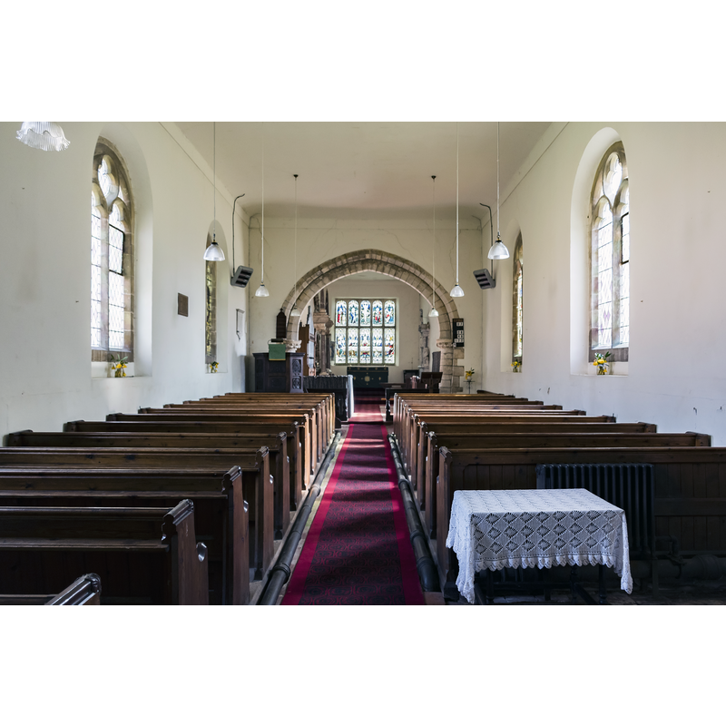 Source caption: "The nave has 19th century windows, the chancel was rebuilt in the late 16th century (to take the Wray monument). The south side of the chancel has a blocked opening to the east and a small 12th century doorway to the west."