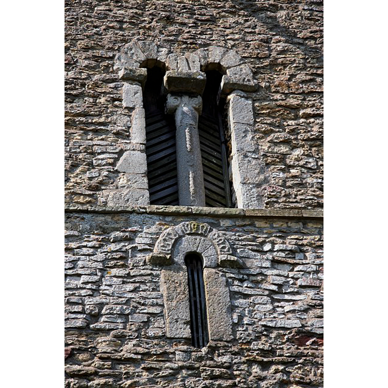 Source caption: "Typically Saxon, 11th century bell opening and keyhole window in the tower of St.Michael's church".