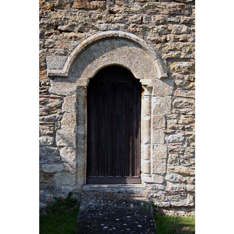 Source caption: "Late 12th century priest's door to the chancel of St.Michael's church".