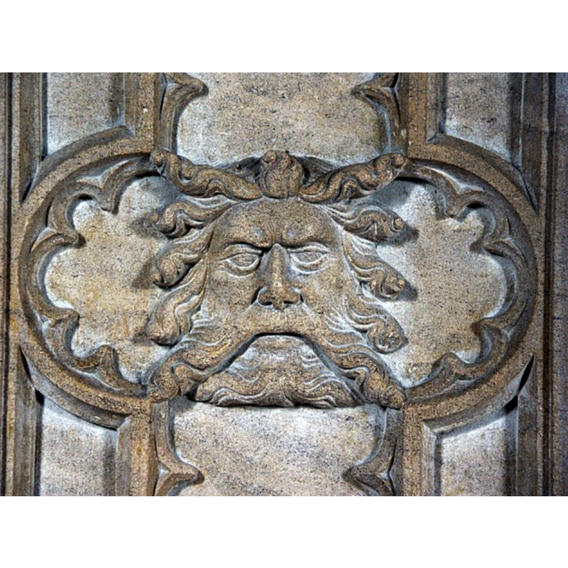 Source caption: "Font detail. If indeed this is the green man, it can be seen on the south facing side of the font." [NB: in a cusped frame; quite likely part of the 19thC restoration of the font]