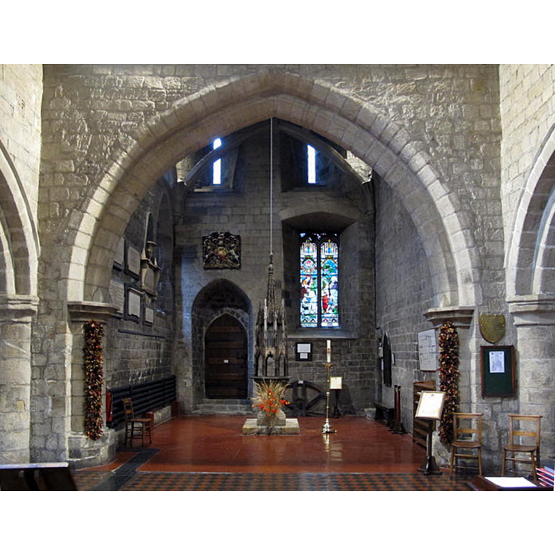 the ample space beneath the tower has been successfully fashioned as baptistery