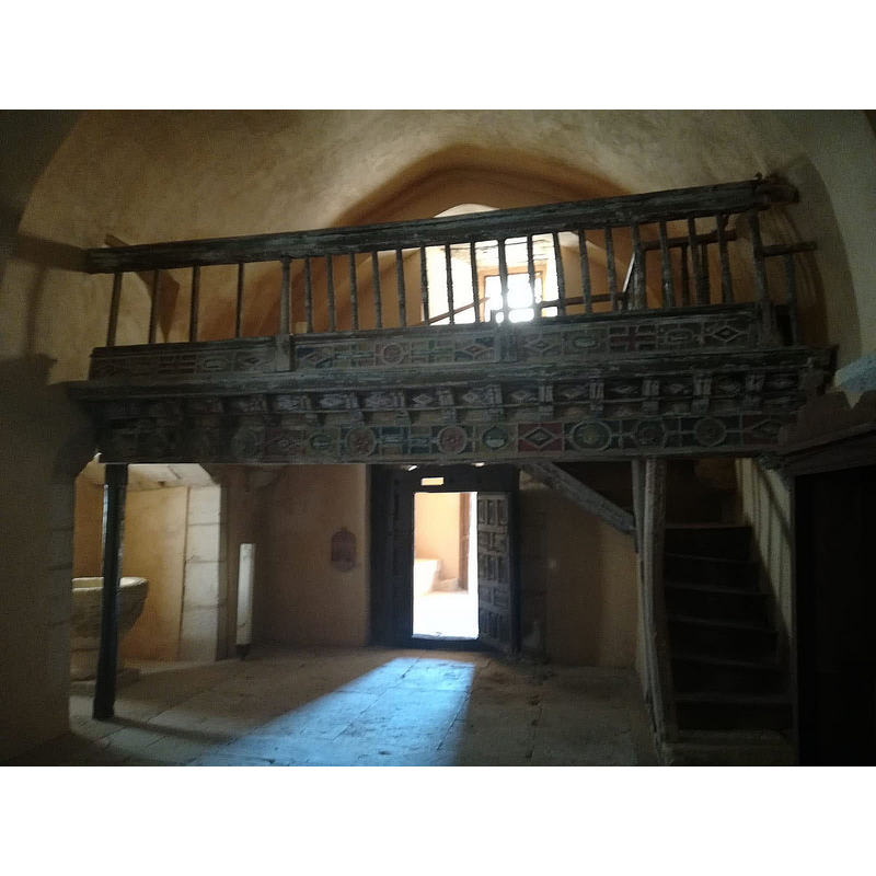 showing the west gallery and the west entranceway -- the baptismal font can be partially seen in a chapel on the left [south] side wall