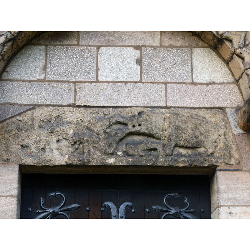 Source caption: "The lintel over the south door is possibly Saxon and depicts a boar hunt"