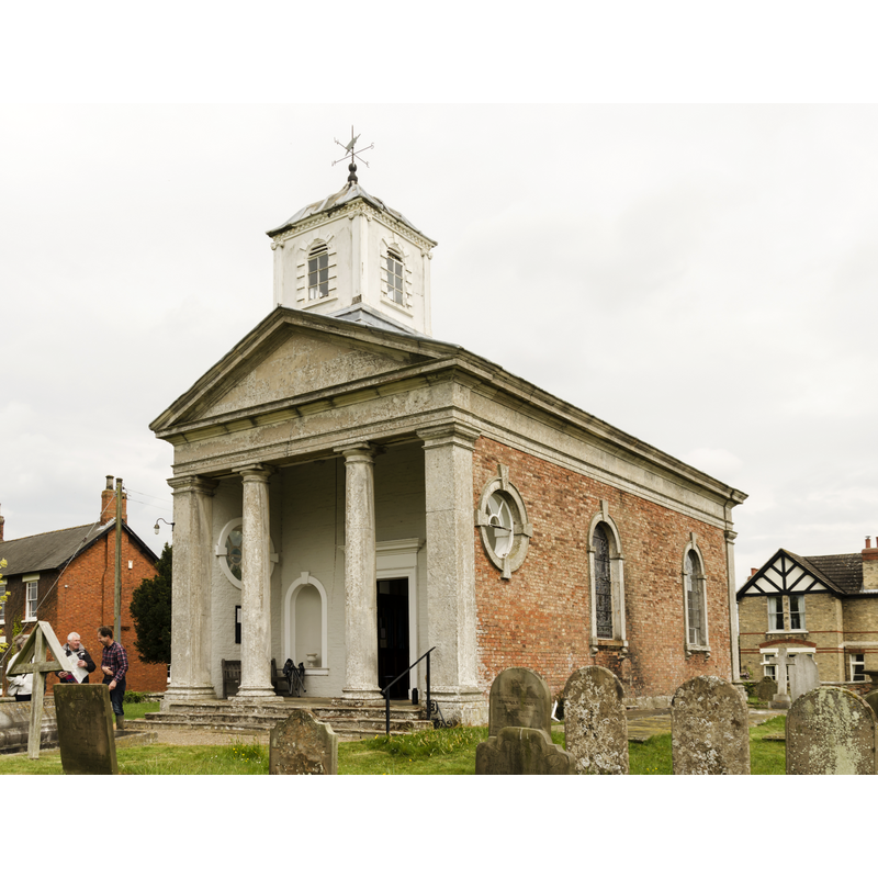 Source caption: "The church was built for the Earls of Scarbrough in 1775, probably by Lancelot "Capability" Brown. It was restored in 1869. It is in the form of a small classical temple with a nave and apse. There is a western bellcote and portico with Tuscan columns. The church is built in redbrick and ashlar with a lead roof."