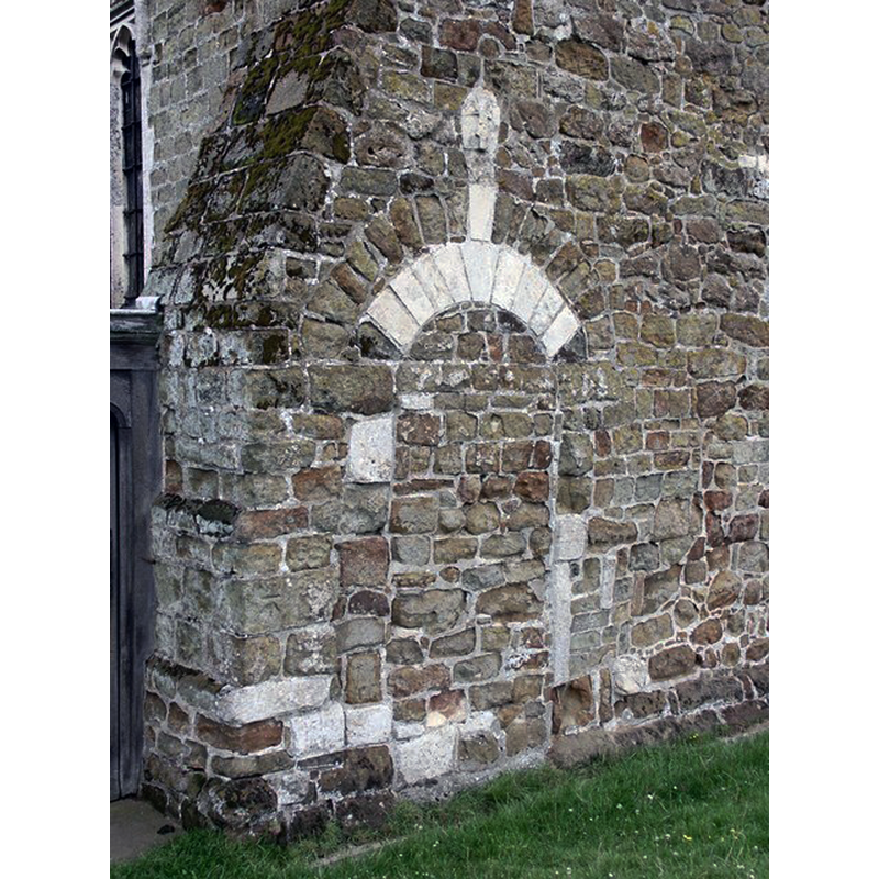Source caption: "Bricked-up south facing doorway in the nave."