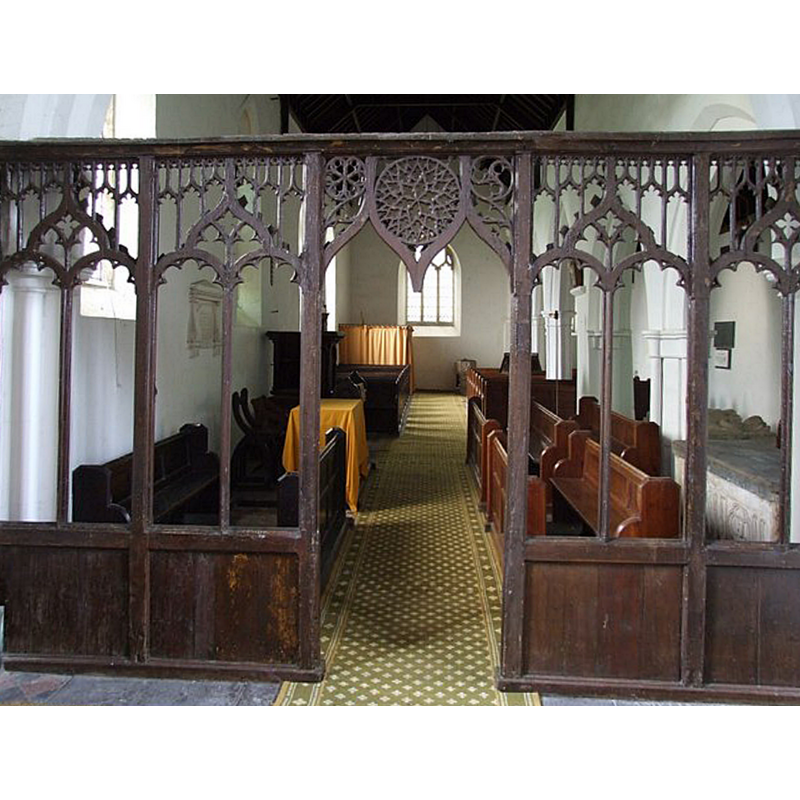 view west of the nave through the chancel screen; the font is partly visible at the far end