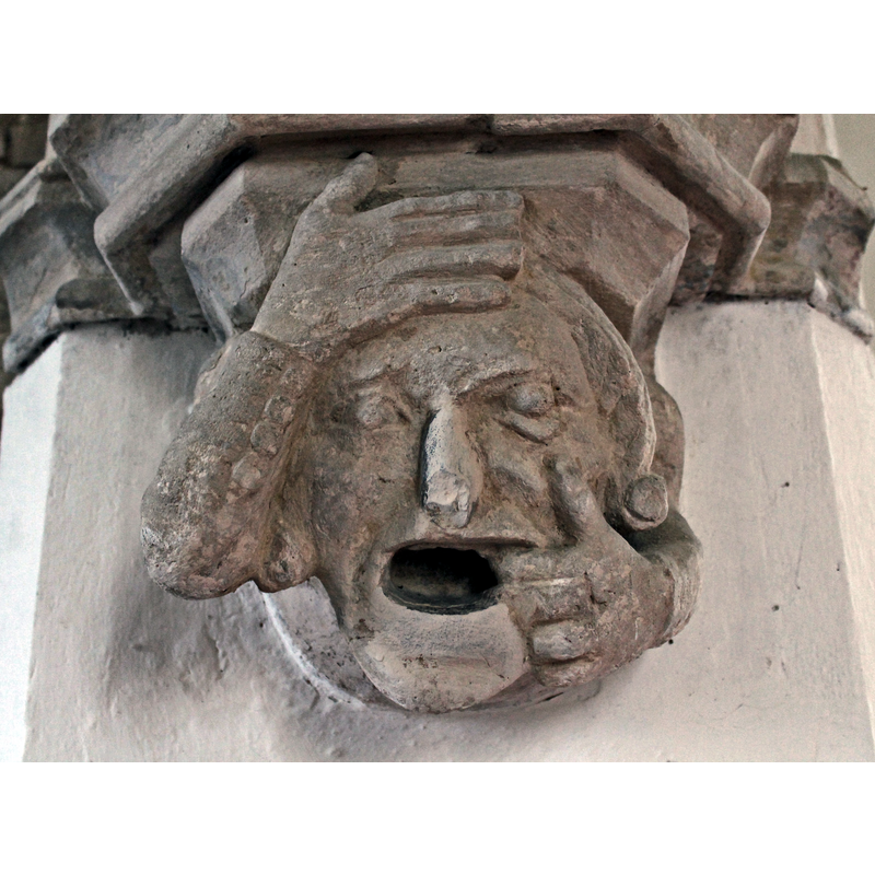 Source caption: "There is a C13 double chamfered chancel arch supported on octagonal imposts having grotesque human head corbels"