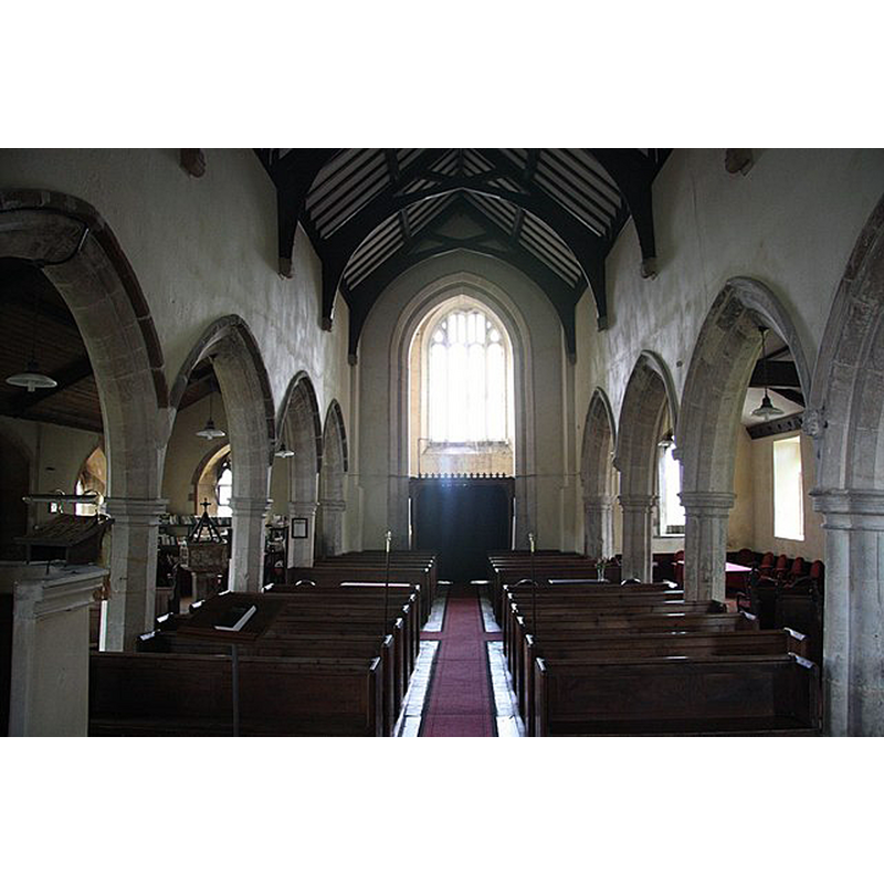 Source caption: "Looking west with 13th century arcades and 15th century tower arch" -- the font and cover are partially visible in the south aisle, opposite the south entranceway