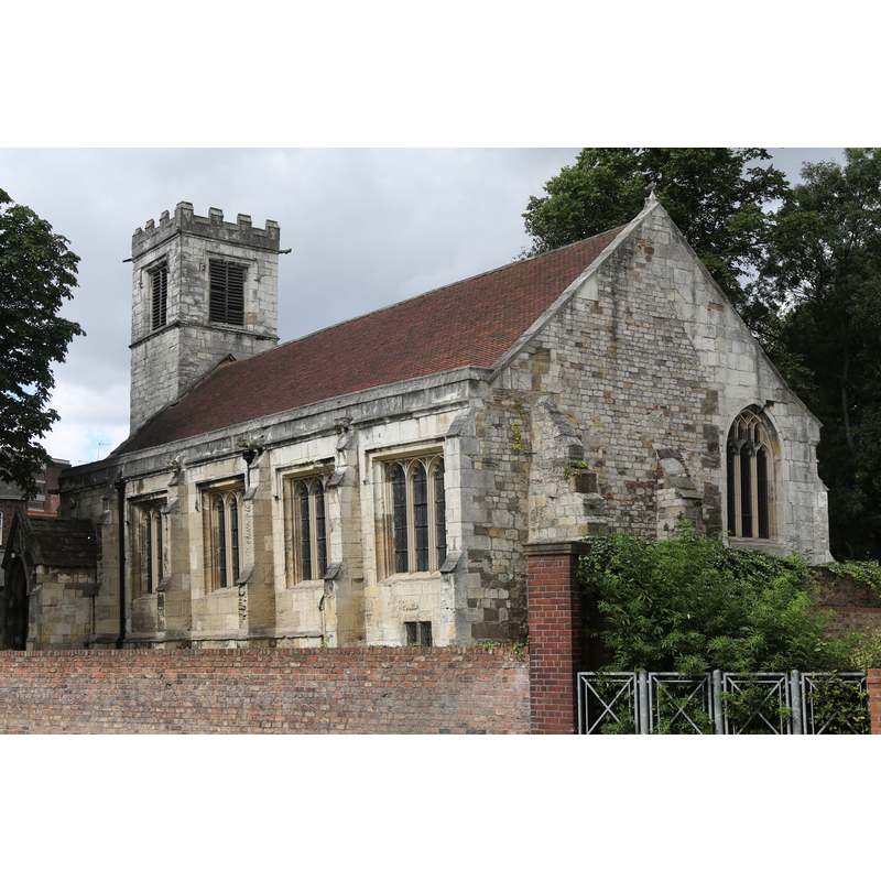 "Parish Church, now offices of Church of St Michael-le-Belfrey, Minster Yard [...] Mid C15 incorporating late C11 east wall; C19 vestry and porch. Restored 1911-12" [source: Historic England [Listing NGR: SE6076652041]]