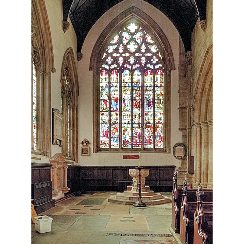 Source caption: "Church of St Mary Magdalene, Baptistry. The baptistery is in the south west corner of the nave. The lower part of the font dates from the fifteenth century with the bowl dating from 1660. The baptistery window was installed in 1892; the theme of the window is Holy Baptism."