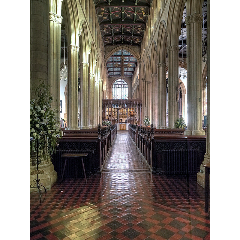 Source caption: "The best interior view of the church is from inside the west door. The great length (222ft) of the church is immediately impressive, almost cathedral-like in its proportions, as we look towards the sixteenth century rood screen and the slender perpendicular columns draw the eye upwards towards the carved ceiling"