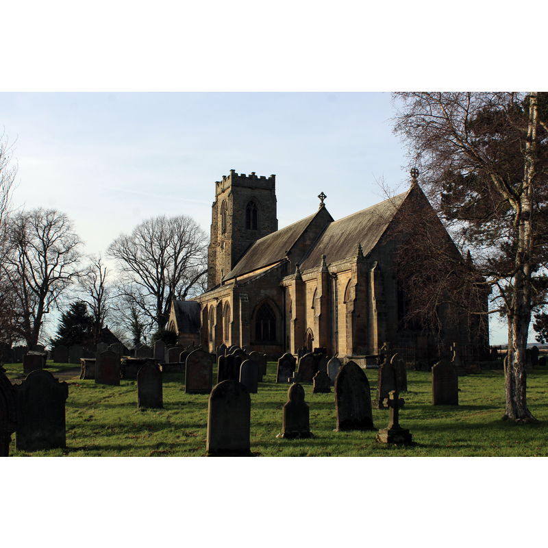 Source caption: "St. Patrick's Church, Patrick Brompton. Occupying an imposing position at the entrance to Wensleydale stands one of only two churches in Yorkshire dedicated to St. Patrick. The building is mostly of the late 12th to 14th century, as illustrated by the design of the columns in the north and south arcades. The chancel is a masterpiece of 14th century architecture and it contains several interesting features – a confessional window, a three-stall sedilia with the decorative heads of a bishop or abbot and priest, a piscina for washing, niches with nodding ogee canopies supported by sculptured heads, and a large monumental canopy. Beside the chancel arch are the remains of a spiral staircase, which once gave access to the rood or crucifixion screen. The Church also houses a good collection of stained glass by Lavers, Barraud and Westlake, Barnett, Hardman, Kempe and Company, Hodgsons, and Tute. The north aisle contains some fragments of 15th century stained glass. The tower has three bells dated around 1400, 1686 and 1703."