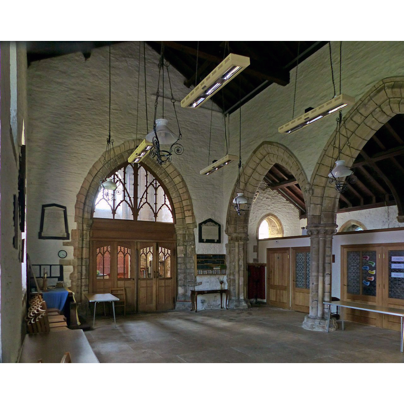 Source caption: "Church of St Peter, Newton-on-Trent. The nave looking west. The tower arch is early 13th century, contemporary with the aisle arcade. The fine screen was inserted in 1937."