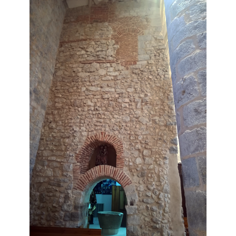 behind the arched doorway is the Capilla de San Pedro Regalado, inside which is the font