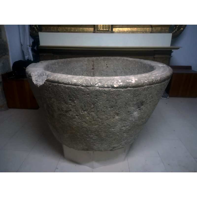 much damaged -- the old stone font is seen here in the Capilla de San Pedro Regalado