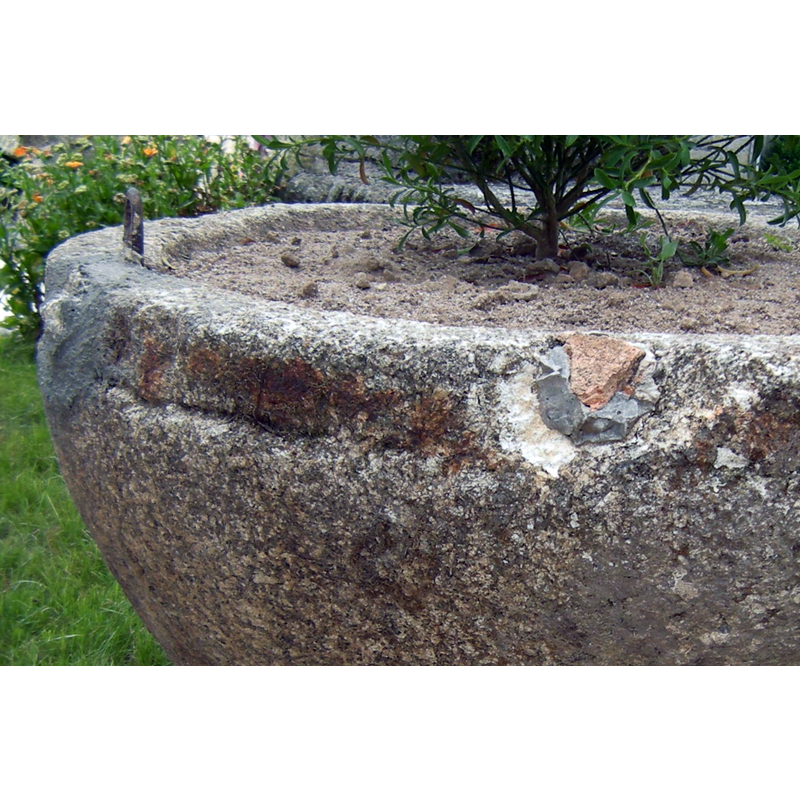 notice the metal staple of the old cover on the left and the grey cement repairs in the area