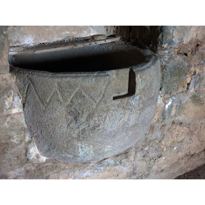 the pattern is a little more regular on this side -- notice the big cut made into the upper rim to fit a cover lock