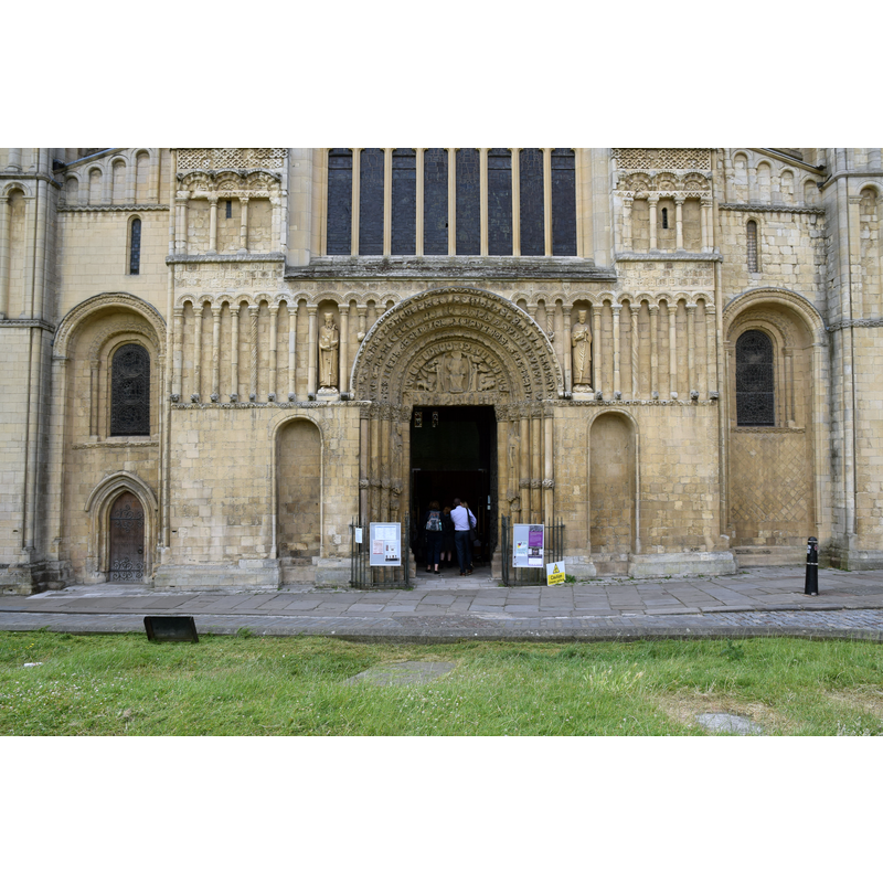 Source caption: "Rochester Cathedral (Cathedral Church of Christ and the Blessed Virgin Mary), Kent, 27 June 2018. Norman, built 1080-1237, with a Priory, on adjacent site of Saxon Cathedral built 604. In 1871-77 the Cathedral was restored by George Gilbert Scott. Pictured is the lower west frontage and doorway."