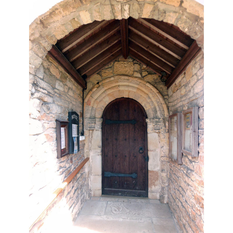 Source caption: "Sinnington church, south doorway. The 12thC Norman doorway has been retained and built into the fabric of the 1904 restoration."